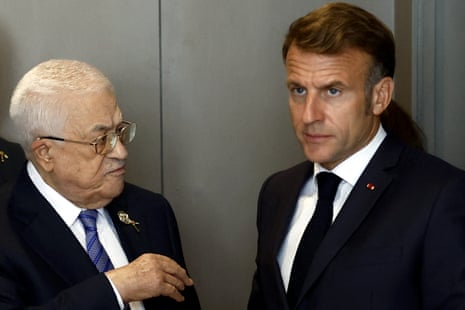 Emmanuel Macron and Palestinian president Mahmoud Abbas leave after their meeting on the sideline of the Sharm El-Sheikh Peace Summit.