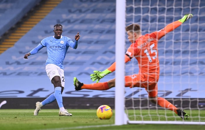 Manchester City’s Benjamin Mendy sidefoots in the third from a tight angle.