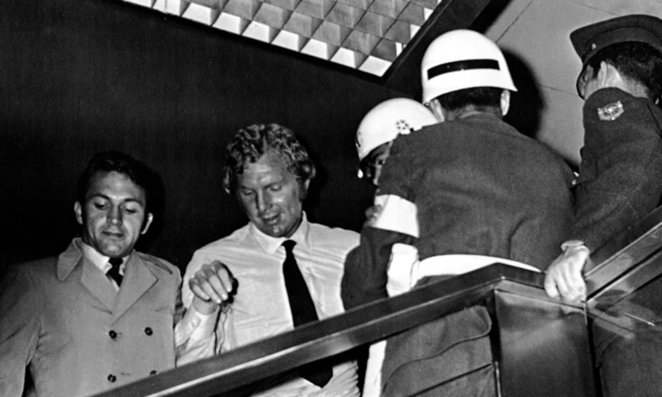 England captain Bobby Moore, in white shirt, leaves the Fuego Verde jewellery shop, in Bogotá, where it was claimed he had stolen a bracelet.