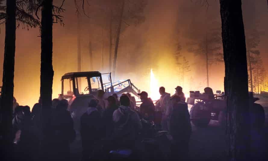 Volunteers prepare to douse a forest fire in the republic of Sakha also known as Yakutia, in Russia’s far east.