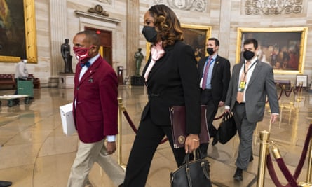 Stacey Plaskett walks through the Capitol Rotunda to the Senate.