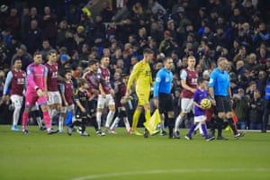 The teams enter the field of play.