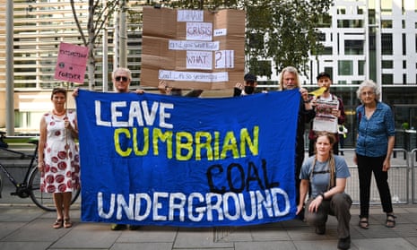 People demonstrate against the proposed coalmine in Cumbria outside the Home Office in London in September 2021