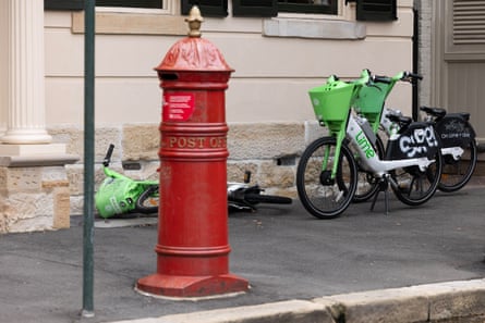 Lime bikes parked on a footpath in the Sydney’s Rocks district