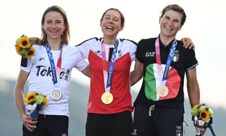 Anna Kiesenhofer of Austria is flanked by Annemiek van Vleuten of the Netherlands (left) and Elisa Longo Borghini of Italy on the podium.
