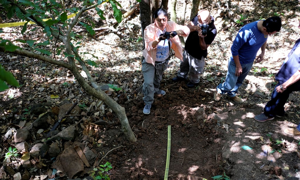 A forensic team works at the village of El Mozote amid a search for bodies.
