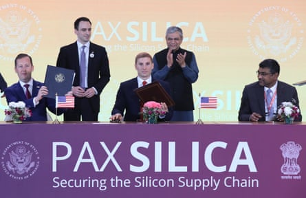 US and Indian officials on stage with a sign ‘Pax Silica’