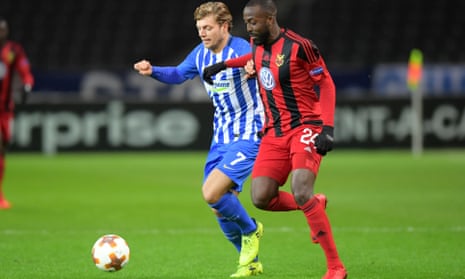 Ronald Mukiibi, right, takes on Hertha BSC in the Europa League group stage