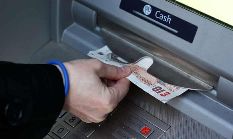 Money being taken out of a cash machine