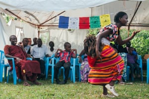 A dancer from the Acholi people from northern Uganda performs at the centre for the Vesak day festivities.