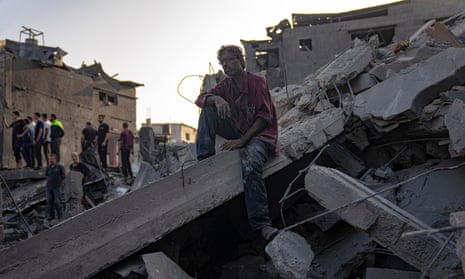 Palestinians look for survivors of an Israeli bombardment in the Maghazi refugee camp in the Gaza Strip.