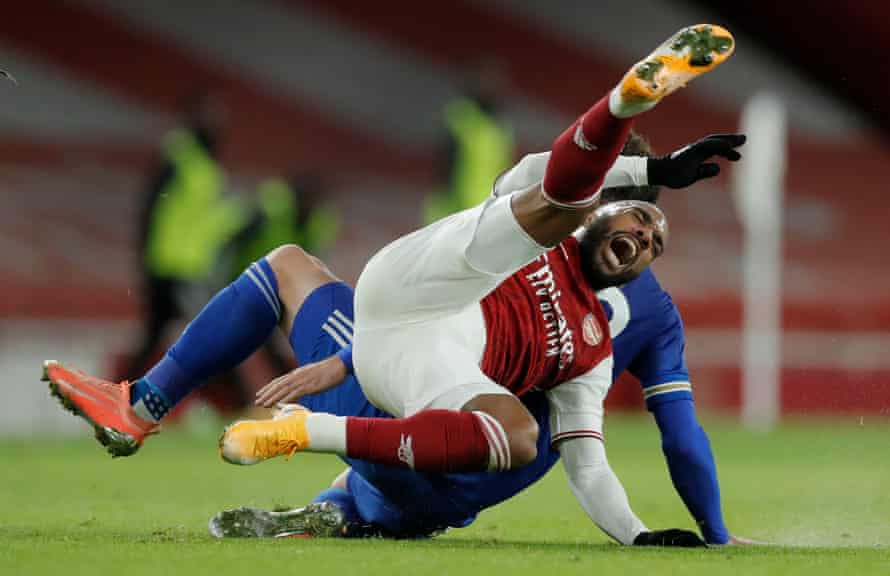 Arsenal’s Alexandre Lacazette is fouled by Leicester City’s Christian Fuchs at the Emirates Stadium.