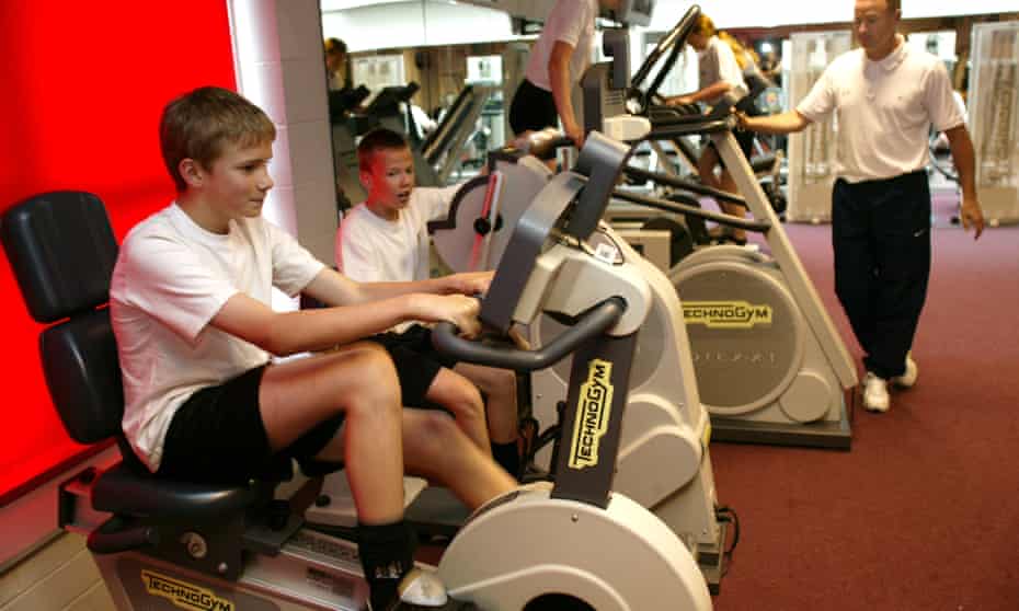 Boys using gym equipment