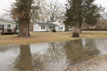 A view of a home with a waterlogged front yard in the Piat Place neighborhood of Centreville. Since the block is at a lower elevation than the surrounding area, it floods faster.