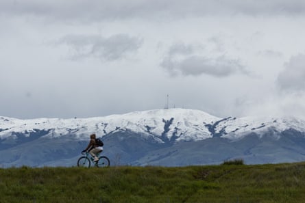 Snow is seen on the hills around the San Francisco Bay area as a strong winter storm pummels California.