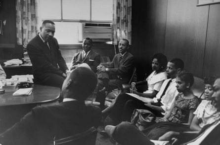 Martin Luther King Jr talking with a group of student sit-in organizers, including Julian Bond, fourth from right, in 1960.