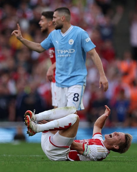 Arsenal's Martin Odegaard reacts after being fouled by Manchester City's Mateo Kovacic.