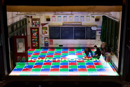 The team lay the digital LED panels that make up the set floor.