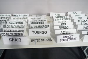 Department and position nameplates are laid out before a meeting of delegates