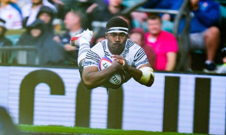 Vinaya Habosi of Fiji goes over for a try against England.