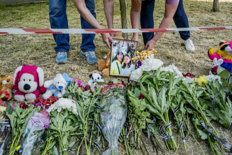 Relatives of two victims killed in Kyiv put their portraits in the small memorial.