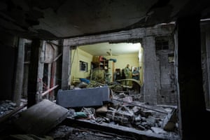 Palestinians inspect a damaged building