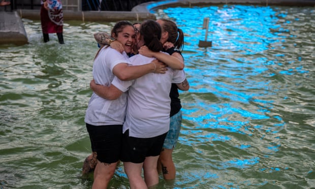 Football fans who had been watching the match on screens on Sunday night celebrated England’s victory in Trafalgar Square’s famous fountains.