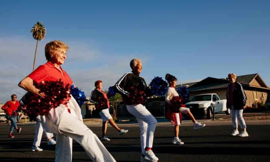 Members of the Sun City Poms cheerleading group practise marching and dancing in unison