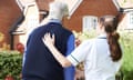 Carer Helping Senior Man To Walk In Garden Using Walking Stick<br>F2T07F Carer Helping Senior Man To Walk In Garden Using Walking Stick