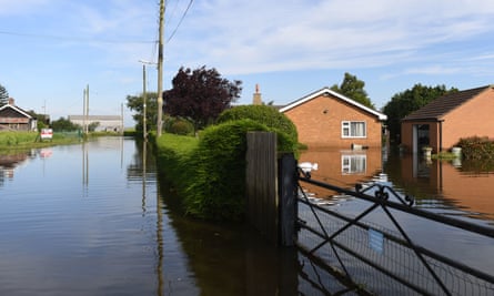 Houses surrounded by flood water on Matt Pit Lane in Wainfleet.