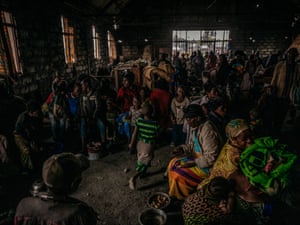 Newly displaced families seeking shelter in a church outside Goma.
