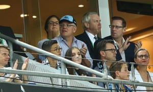 Scott Morrison watches the round four NRL match between the Parramatta Eels and the Cronulla Sharks at ANZ Stadium in Sydney on Saturday night. The PM has decided not to call the election on Sunday.