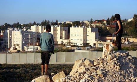 Palestinian boys look towards the Israeli settlement of Beit El, in the occupied West Bank. Israel has appointed a settler, Dani Dayan, as its ambassador to Brazil, a position Brasilia has yet to confirm. 