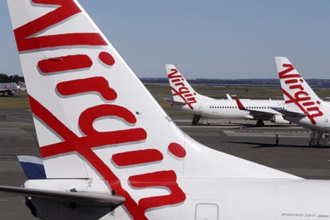 Virgin Australia planes are parked at terminal at Sydney Airport in Sydney.