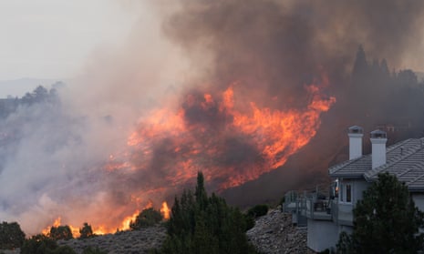 Flames engulf a hillside near a residential neighborhood in Reno, Nevada. 