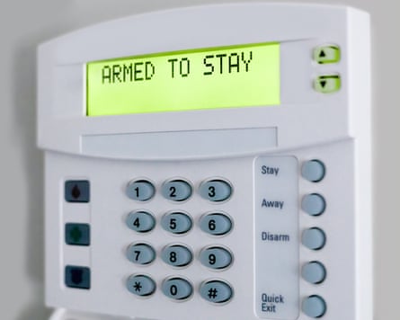 Close-up of home security keypad showing system ‘Armed to Stay’.