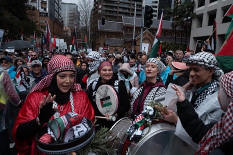 People play instruments as they march in support of Palestinians in Gaza