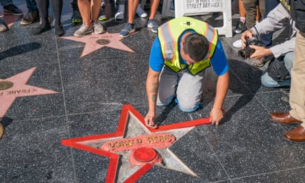 Workers reforge Donald Trump’s star on the Hollywood Walk of Fame after it was destroyed on 26 October 2016.