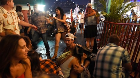 ‘People started dropping around us’: Las Vegas shooting told by witnesses - video report 