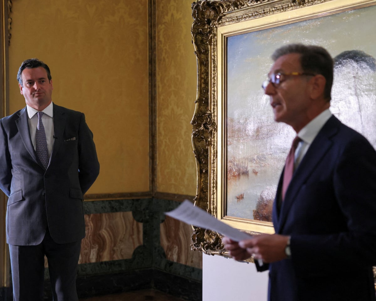 The two men standing near the Turner painting