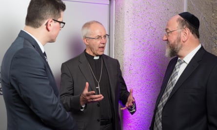 Safet Vukalić, left, a survivor of the genocide in Bosnia, meets Justin Welby and the chief rabbi, Ephraim Mirvis