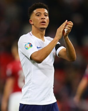 Jadon Sancho applauds England’s supporters at full-time.