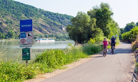 Mother and daughter cycling along Danube river in Wachau Valley, Austria