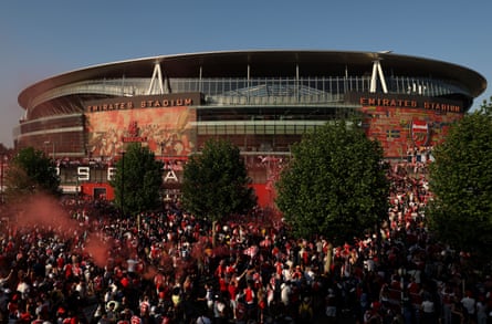 Arsenal fans celebrate at the Emirates Stadium