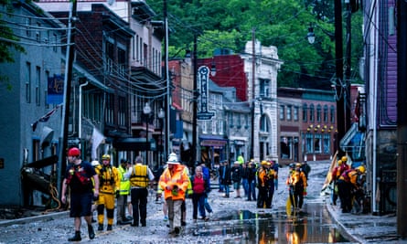 Rescue personnel examine damage on Main Street after a flash flood rushed through the historic town of Ellicott City, Maryland on 27 May 2018.