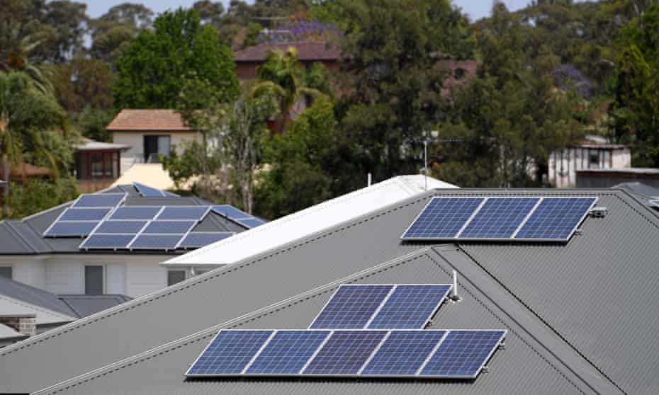 Solar panels are seen on the rooftops of houses in north-west Sydney.