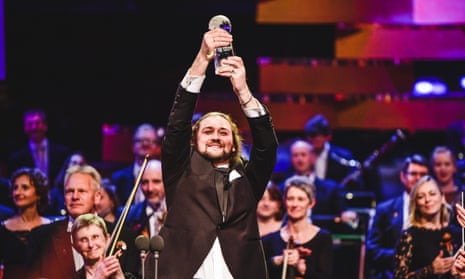 Charisma and intimacy … Andrei Kymach holds his award aloft.