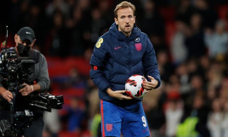 England captain and hat trick hero Harry Kane picks up the match ball at the end of the game.