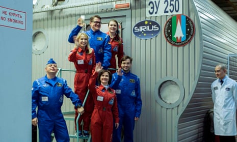 Members of the SIRIUS-17 mission wave before being locked into in an isolation facility at Russia’s Institute for Bio-Medical Problems in Moscow.