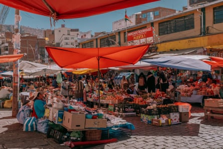 Vendors at the Rodríguez market in La Paz beneath canopies to shelter from the sun